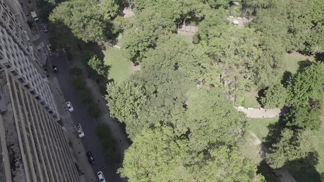 Drone Panning Up from Rittenhouse Square to Hotel Buildings in Philadelphia, PA - 4K