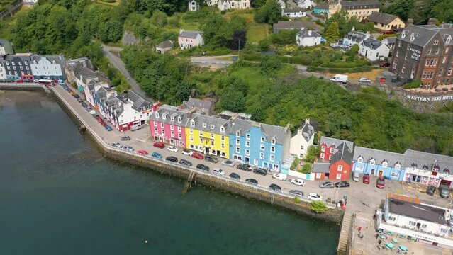 An aerial drone video of Tobermory on the Isle of Mull in Scotland. A small town with colourful houses. 