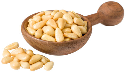 Roasted pine nuts in the wooden spoon, isolated on the white background.
