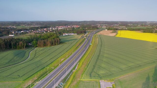 Aerial view of highway S6 through lush farm landscape in Kielno, Gdynia, Poland