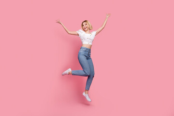 Fototapeta na wymiar Full length body photo of crazy woman jump celebrate victory hands up hooray summer weekend party chill isolated on pink color background