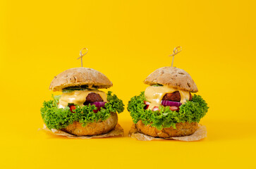 Delicious Burgers with Vegetables and Sauce, Fresh and Tasty Plant Based Meatless Burgers on Yellow...