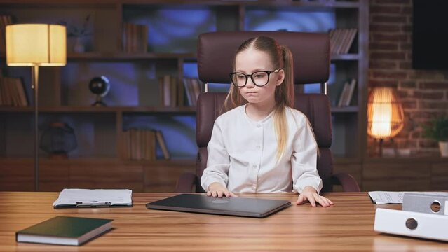 Little Executive Closing Laptop And Being Annoyed Because Of Gadget's Bad Work And Low Internet Connection. Irritated Kid Shouting At Computer And Leaning On Elbows With Boring Face Expression.