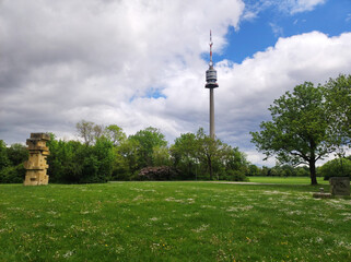 Obraz premium view of the Danube Tower in Vienna with cloudy sky in the background