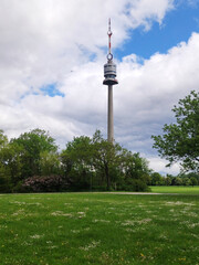 Naklejka premium view of the Danube Tower in Vienna with cloudy sky in the background