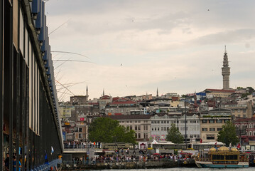 Loads of fishermen fishing from a bridge in Istanbul