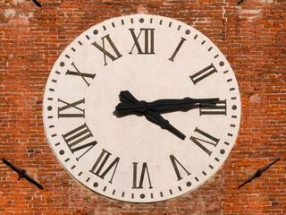 Time and hours. Old clock with roman numbers