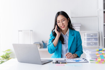 Asian businesswoman modern professional talking with client on the phone with a confident demeanor and effective communication skill. business, marketing, sale and communication project.