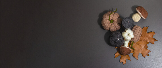 Traditional autumn background. Assorted of knitted pumpkin, candles, maple leaves, handmade concept