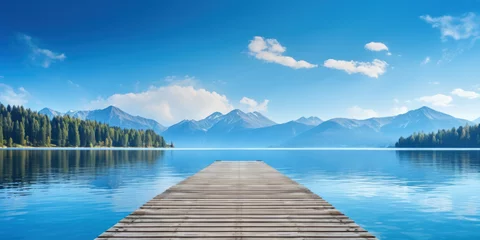 Fototapeten landscape with wooden pier or jetty on lake with mountains © mimadeo