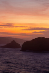Naklejka na ściany i meble Enchanting Sunset at San Juan de Gaztelugatxe: A Majestic Coastal Haven bathed in Twilight