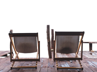 Back view of two vintage deckchairs on wooden wet floor
