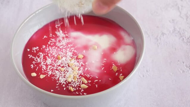 Malabi - traditional Arabic dessert. Milk pudding with rose syrup and nuts.