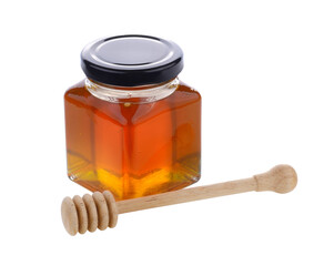 Honey with wooden honey dipper on transparent png