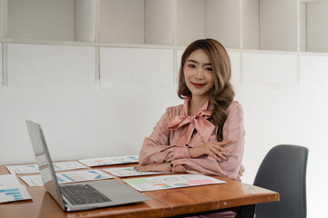 Portrait of businesswoman in office looking at camera. Confident business woman with
