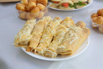 Pancakes with minced meat on a white background