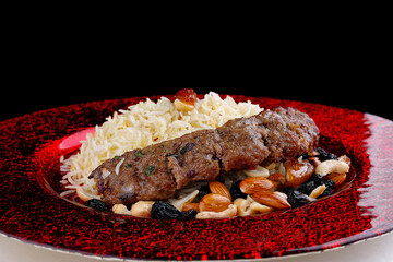 Oriental pilaf with lula kebab and nuts in honey