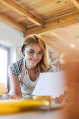 Smiling artist working in studio