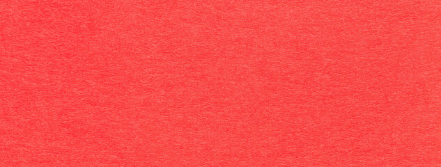 Fototapeta premium Texture of old bright red color paper background, macro. Structure of a vintage craft ruby cardboard.