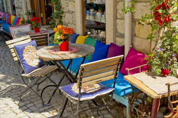 table and chairs in a cafe in alacati, izmir
