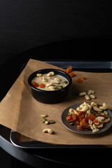 Breakfast oatmeal vegan bowl with nuts