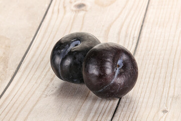 Two ripe sweet black plums