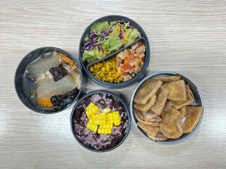 Stir pork curry and tomato fried with fried tofu and soup and corn mixed two tone brown rice
