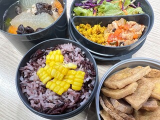 Stir pork curry and tomato fried with fried tofu and soup and corn mixed two tone brown rice