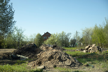 Excavated earth. Abandoned plot of land. Excavated soil.