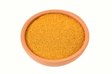 Turmeric pieces on clay pot, isolated on white. copy space. top view. Heap of turmeric powder on white background, view from above.