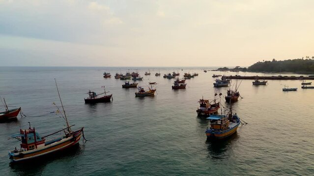 Bird eye view of the classic Sri Lanka fisherman boats docked in Weligama harbour during sunset - Sri Lanka