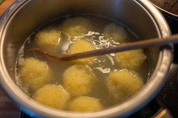 pot of boiling water and dumplings
