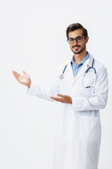 Man doctor in white coat and eyeglasses smile shows hand gestures signs on white isolated background looks into camera, copy space, space for text, health