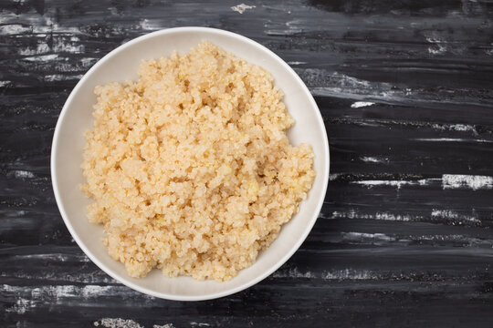 Tasty fresh boiled quinoa in white bowl