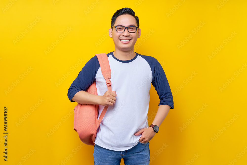 Wall mural smiling attractive young asian man student wearing casual clothes standing confident while looking a - Wall murals