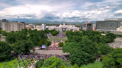 Crowds at Denver Civic Center Park to celebrate Nuggets NBA champions. Aerial