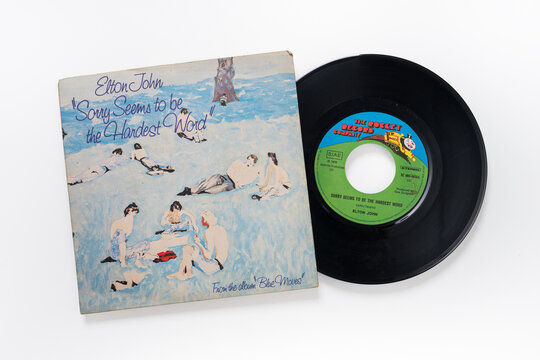 Elton John English singer 45rpm vinyl record. White background. Udine Italy_June 25 2023