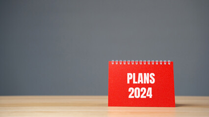 Notes with words Plans 2024. Planning goals and tasks. New business ideas. Setting goal, target....