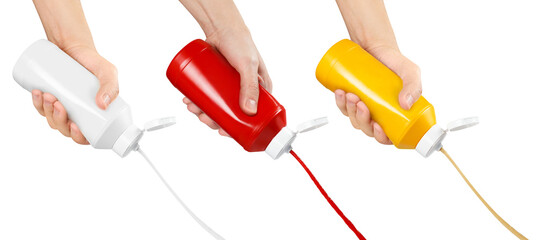Set of hands squeezing mustard, ketchup and mayonnaise out of plastic bottles, cut out