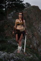 Beautiful female viking woman warrior with sword. Red amazon fantasy - 617009778