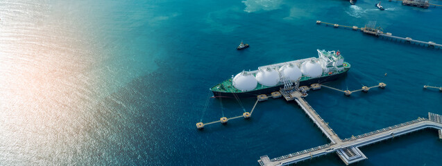 LNG (Liquified Natural Gas) tanker anchored in Gas terminal gas tanks for storage. Oil Crude Gas...