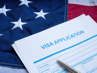 Fototapeta premium Visa application form on the USA flag.