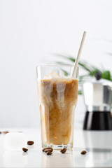 One iced coffee with paper straw with milk cold beverage