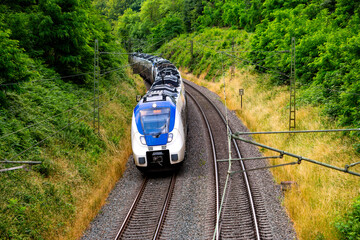 German regional train in a curve of the main railway line between cologne and Berlin near Dortmund...