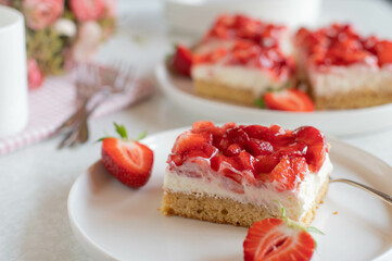 Cake with strawberries, whipped cream and mascarpone cheese on plate