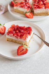 Slice of strawberry cream cake on a plate
