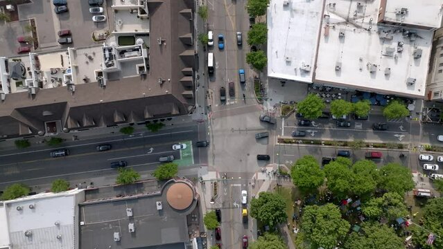 Intersection in downtown Plymouth, Michigan with drone video overhead and moving down.