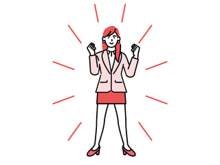 A businesswoman standing confidently straight ahead with both hands clenched into fists.