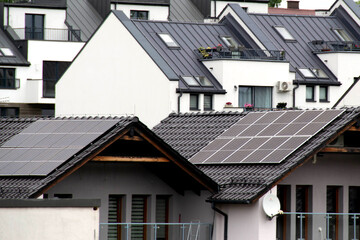 Installing a Solar Cell on a Roof. Solar panels on roof. Historic farm house with modern solar panels on roof and wall. High quality photo