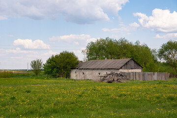 Obraz premium Old brick house in the field in Belarus